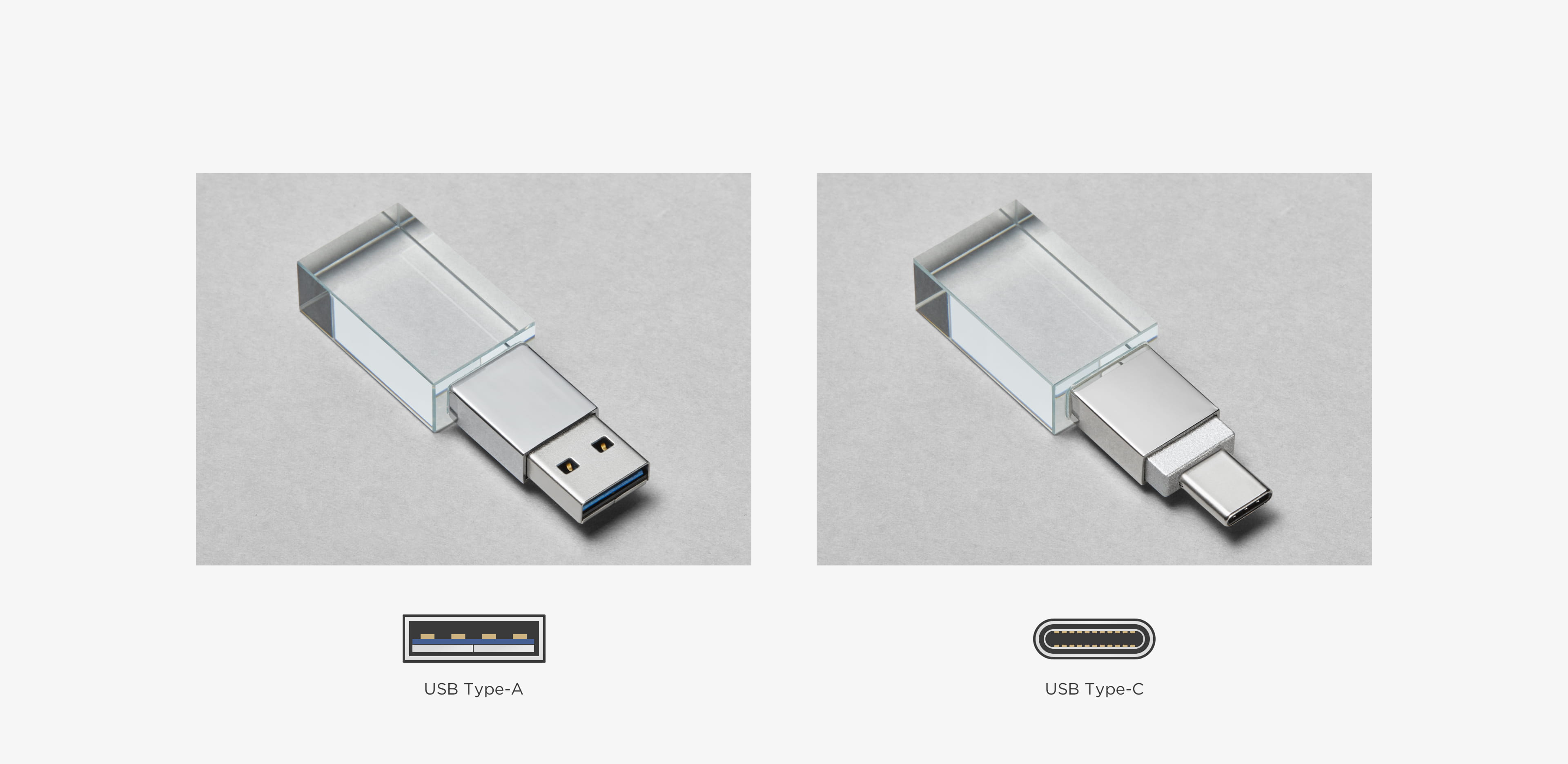 three crystal usb drives in different printing options on a grey table