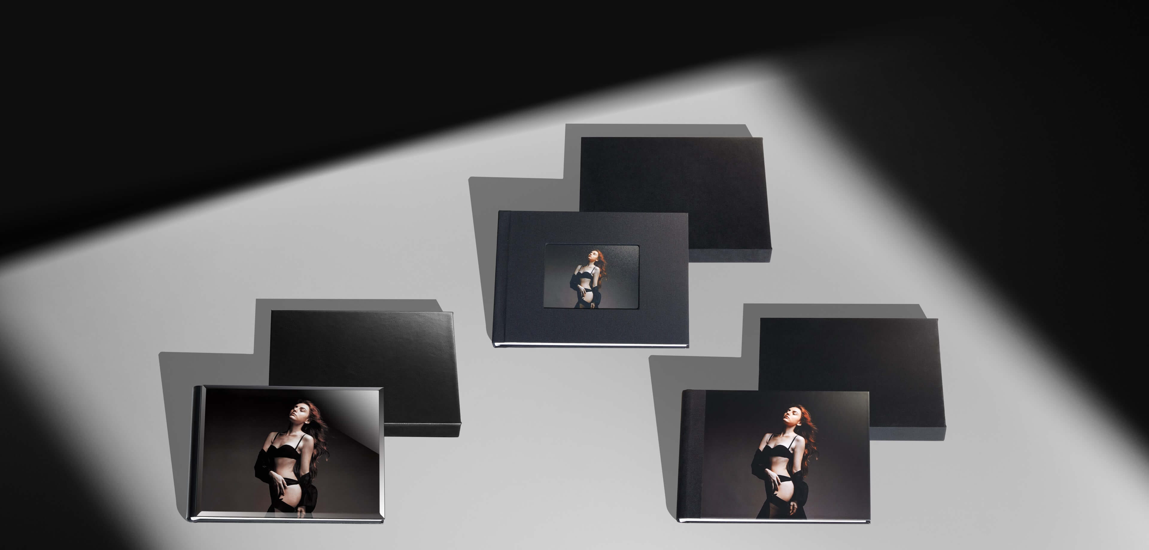 three slipcase album sets with different style albums